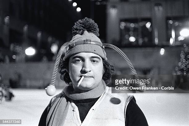 Comedian John Belushi, in a bumble bee costume, skates at the Rockefeller Center Ice Rink for a skit on Saturday Night Live.
