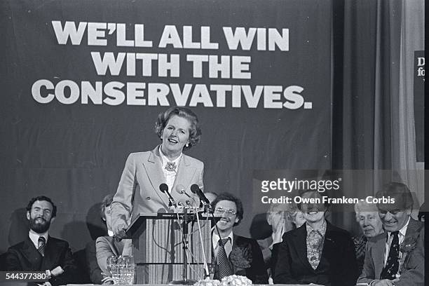 British prime minister candidate Margaret Thatcher speaks at a podium in an arena during the 1979 parliamentary election. Thatcher, representing the...