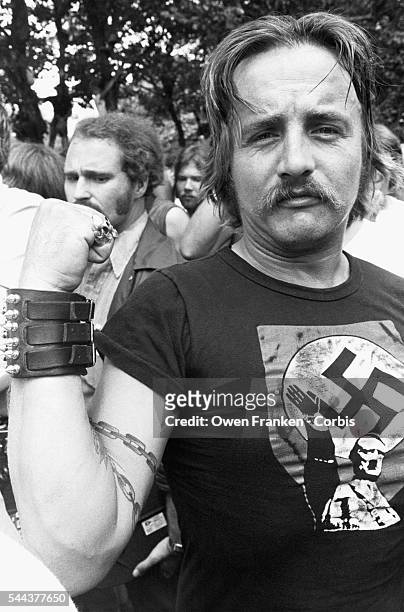 Man wears a t-shirt with an image of Hilter at a gathering of American Nazis. Protected by anti riot policy, Frank Collin, leader of the American...