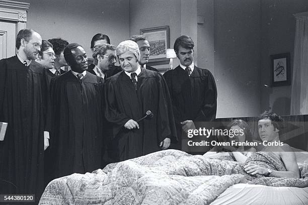 In a Saturday Night Live skit, Chevy Chase and Jane Curtin play a couple monitored in bed by the Supreme Court. The skit aired after the court upheld...