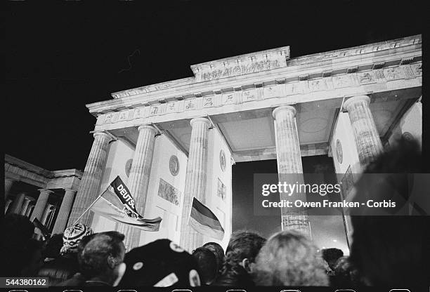 Crowds converge on the Brandenburg Gate at midnight October 2-3 the moment that the official reunification of East and West Germany took effect....