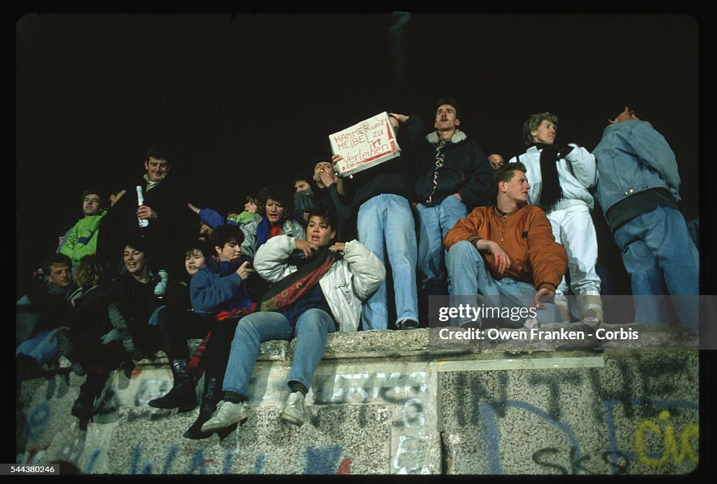 Revelers on Berlin Wall