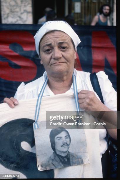 Woman wears a photograph of her son who disappeared during years of political oppression by the government in Argentina. She is one of the Madres de...