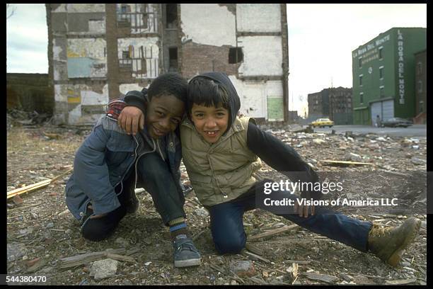 Two boys in a vacant lot in New York's South Bronx neighborhood, 1986. | Location: South Bronx, New York, New York, USA.