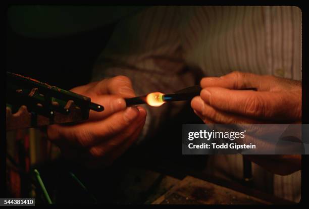 Glass Blower Working With Molten Glass