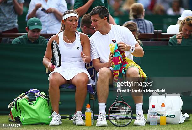 Tara Moore of Great Britain and Ken Skupski of Great Britain in conversation during the Mixed Doubled first round match against Robert Lindstedt of...