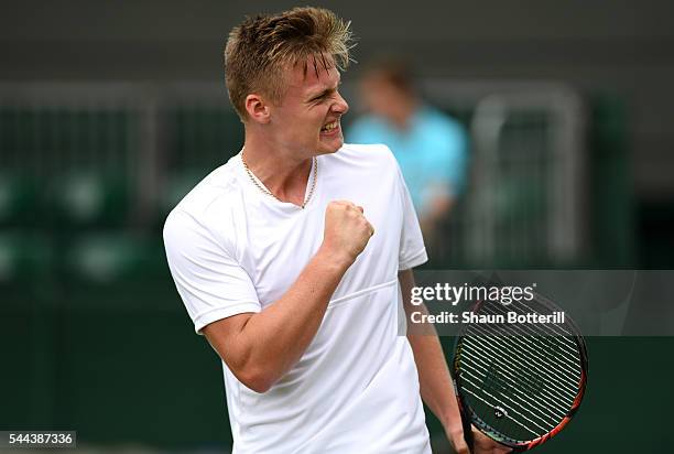 Finn Bass of Great britain celebrates during the Boy's singles first round match against Marvin Moeller of Germany on Middle Sunday of the Wimbledon...