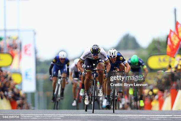 Peter Sagan of Slovakia and the Tinkoff team crosses the line to win stage two of the 2016 Tour de France from Saint-Lo to Cherbourg-Octeville on...