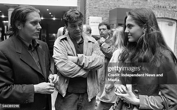 Film producer Steve Woolley and director, producer, and writer Neil Jordan speak with an unidentified woman at the Gregory Peck Script Writing Summer...