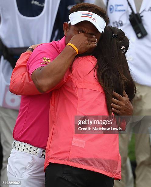 Thongchai Jaidee of Thailand celebtrates his win with his wife during day four of the 100th Open de France at Le Golf National on July 3, 2016 in...