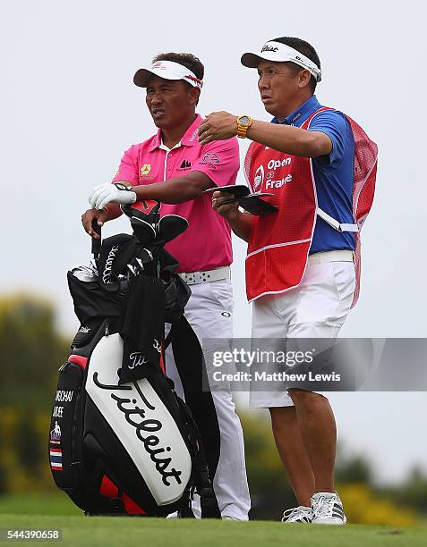 Thongchai Jaidee of Thailand looks on with his caddie during day four of the 100th Open de France at Le Golf National on July 3, 2016 in Paris,...