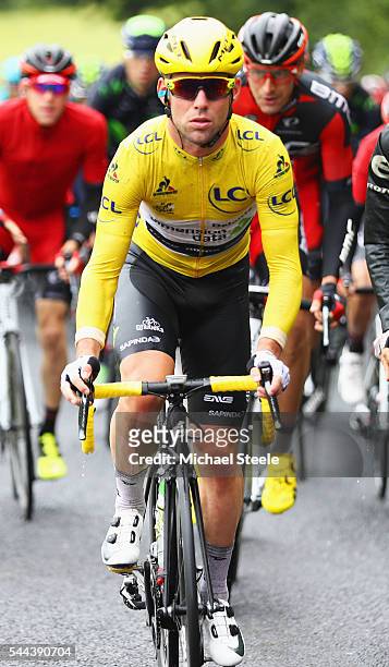 Mark Cavendish of Great Britain and Team Dimension Data wears the yellow leader jersey as he rides during stage two of the 2016 Tour de France from...