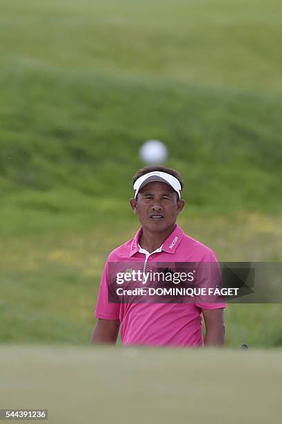 Thailand's Thongchai Jaidee plays a bunker shot on the 16th hole during the last round of the 100th French Golf Open on July 3, 2016 at Le Golf...