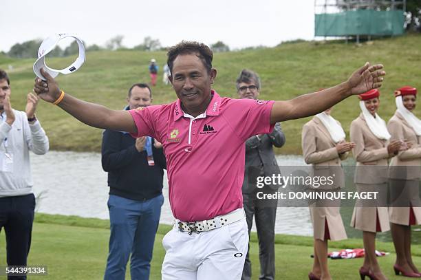 Thailand's Thongchai Jaidee celebrates after winning the 100th French Golf Open on July 3, 2016 at Le Golf National in Guyancourt, near Paris. / AFP...