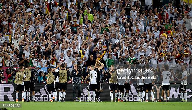 Germany players applaud the supporters after their win through the penalty shootout during the UEFA EURO 2016 quarter final match between Germany and...