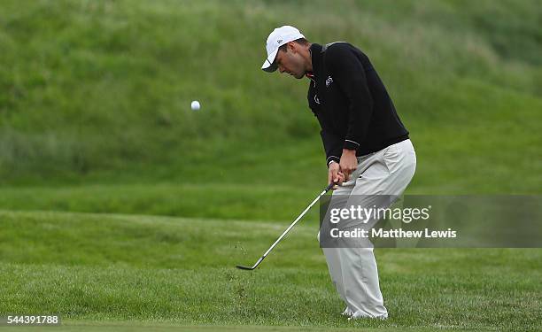 Martin Kaymer of Germany chips onto the 9th green during day four of the 100th Open de France at Le Golf National on July 3, 2016 in Paris, France.