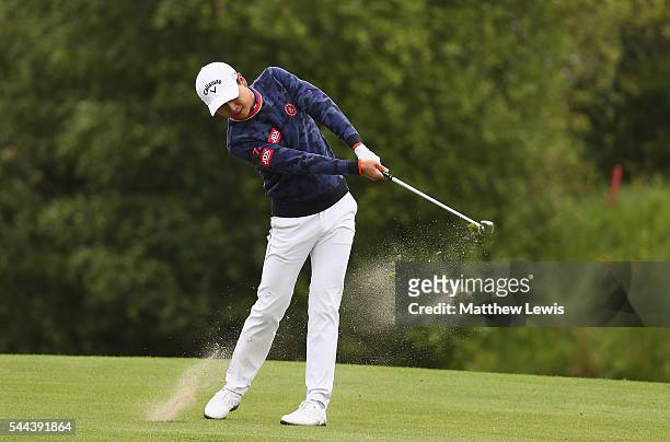 Jeunghun Wang of Korea plays a shot from the fairway during day four of the 100th Open de France at Le Golf National on July 3, 2016 in Paris, France.