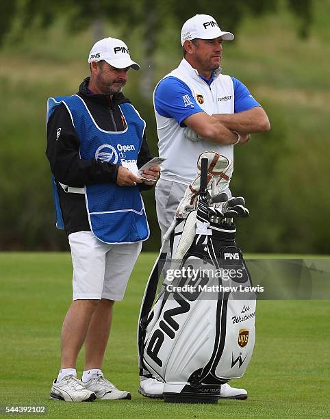 Lee Westwood of England looks on with his caddie during day four of the 100th Open de France at Le Golf National on July 3, 2016 in Paris, France.