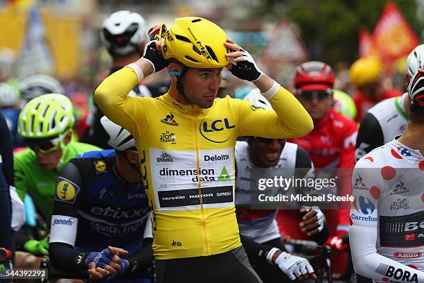 Yellow jersey race leader Mark Cavendish of Great Britain and Team Dimension Data prepares on the starting line ahead of stage two of Le Tour de...