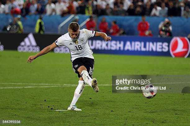 Toni Kroos of Germany scores during the penalty shoot out following the UEFA Euro 2016 Quarter Final match between Germany and Italy at Nouveau Stade...