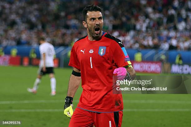 Gianluigi Buffon of Italy celebrates after saving the penalty of Thomas Muller of Germany during the shoot out following the UEFA Euro 2016 Quarter...