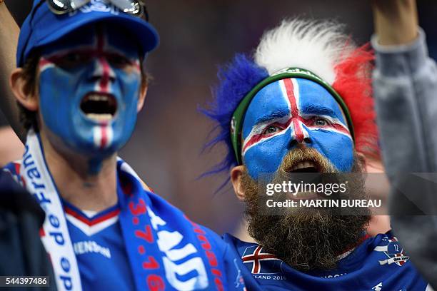 Iceland supporters are pictured ahead the Euro 2016 quarter-final football match between France and Iceland at the Stade de France in Saint-Denis,...