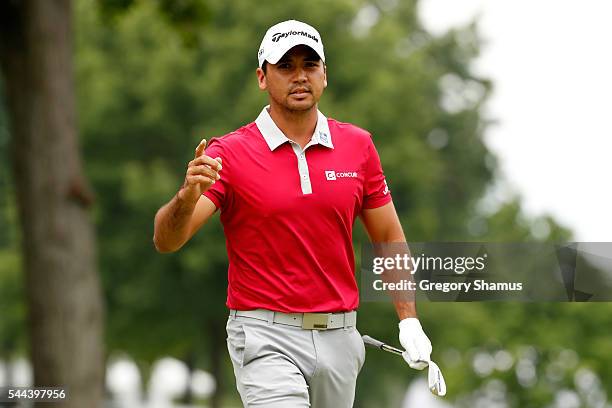 Jason Day of Australia reacts after chipping in for eagle on the second hole during the final round of the World Golf Championships - Bridgestone...