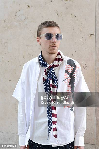 Fashion student Tomas Clemence wears The Soloist shorts, vintage scarf and Sasquatchfabric shirt on day 3 of Paris Collections: Men on June 24, 2016...