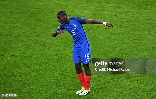 Paul Pogba of France celebrates scoring his team's second goal during the UEFA EURO 2016 quarter final match between France and Iceland at Stade de...