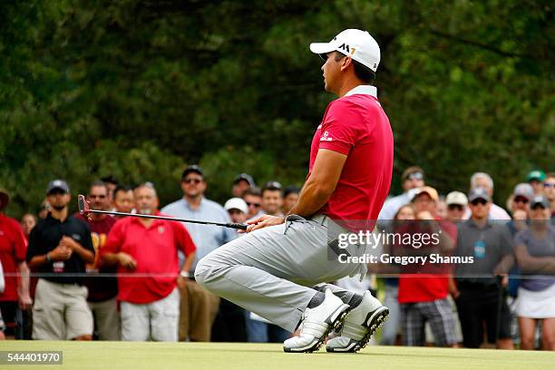 Jason Day of Australia reacts to a missed birdie putt on the fourth green during the final round of the World Golf Championships - Bridgestone...