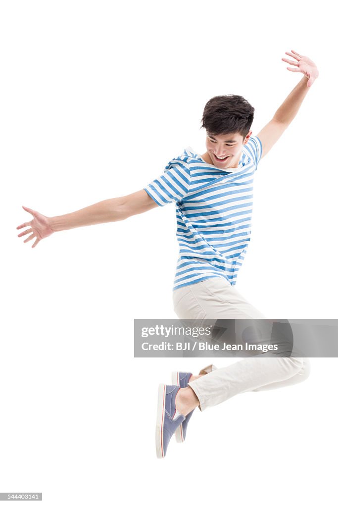 Happy young man jumping