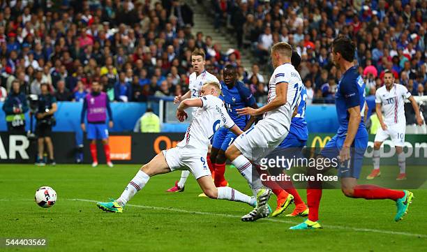 Kolbeinn Sigthorsson of Iceland scores his team's first goal during the UEFA EURO 2016 quarter final match between France and Iceland at Stade de...