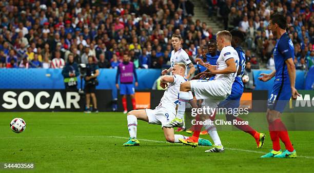 Kolbeinn Sigthorsson of Iceland scores his team's first goal during the UEFA EURO 2016 quarter final match between France and Iceland at Stade de...