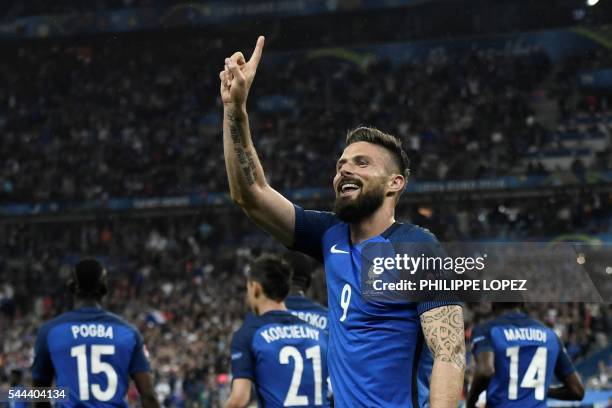 France's forward Olivier Giroud celebrates after scoring another goal during the Euro 2016 quarter-final football match between France and Iceland at...