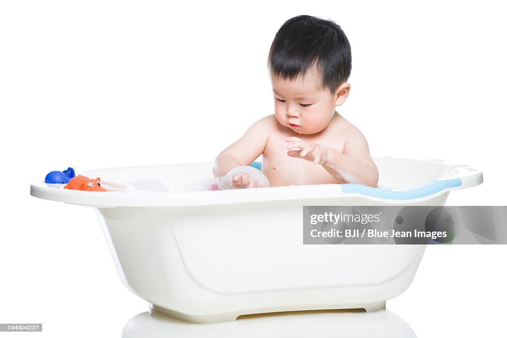 Cute baby in bathtub