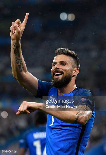 Olivier Giroud of France celebrates scoring his team's fifth goal during the UEFA EURO 2016 quarter final match between France and Iceland at Stade...