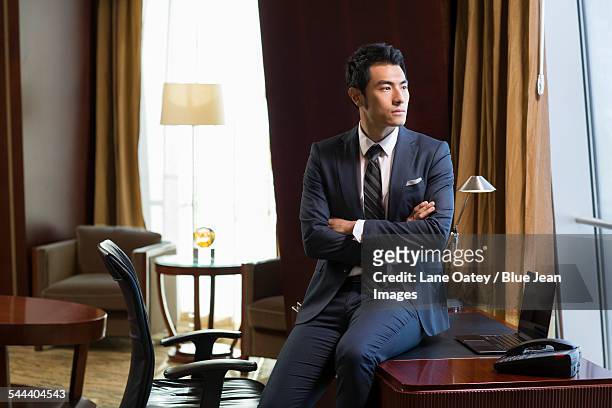 successful businessman sitting in study - millionnaire ストックフォトと画像