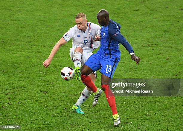 Kolbeinn Sigthorsson of Iceland and Eliaquim Mangala of France compete for the ball during the UEFA EURO 2016 quarter final match between France and...