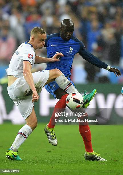 Kolbeinn Sigthorsson of Iceland and Eliaquim Mangala of France compete for the ball during the UEFA EURO 2016 quarter final match between France and...