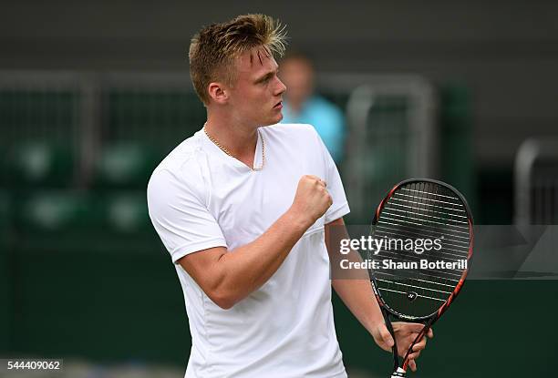 Finn Bass of Great britain celebrates during the Boy's singles first round match against Marvin Moeller of Germany on Middle Sunday of the Wimbledon...