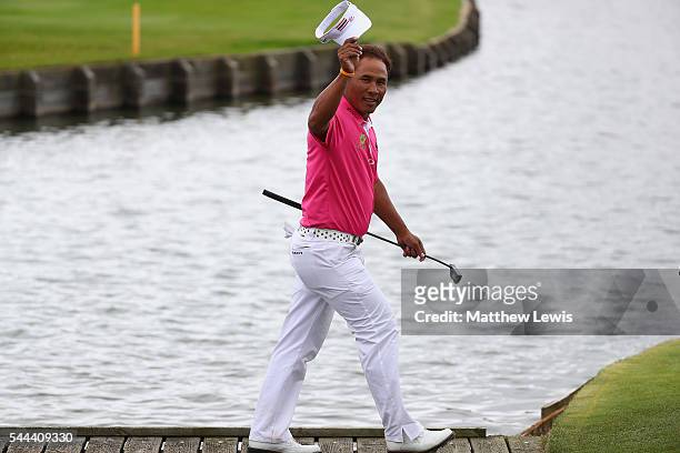 Thongchai Jaidee of Thailand looks on, as he walks onto the 18th green during day four of the 100th Open de France at Le Golf National on July 3,...
