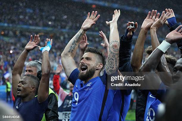 Players of France celebrate victory over Iceland after the UEFA Euro 2016 quarter final match between France and Iceland at Stade de France in Saint...