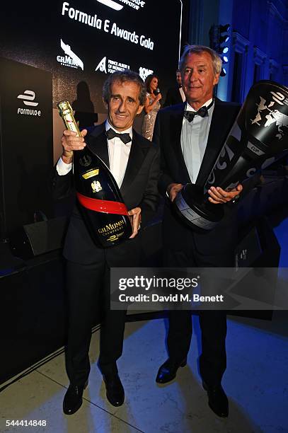 Alain Prost and Jean-Paul Driot accept their awards at the 2016 FIA Formula E Visa London ePrix gala dinner at The British Museum on July 3, 2016 in...