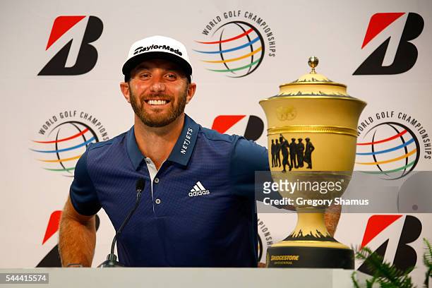 Dustin Johnson speaks to the media with the Gary Player Cup after winning the World Golf Championships - Bridgestone Invitational during the final...