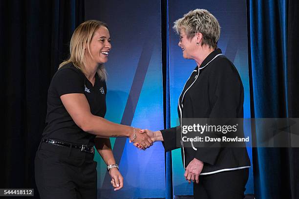 Huriana Manuel shakes hands with Kereyn Smith, Secretary General NZOC during the New Zealand Olympic Games Rugby Sevens Team Announcement at Eden...