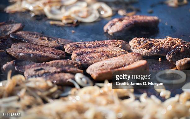 Sausages on the barbeque at a polling station on July 2, 2016 in Sydney, Australia. Sausage sizzles have over time become an Australian tradition on...