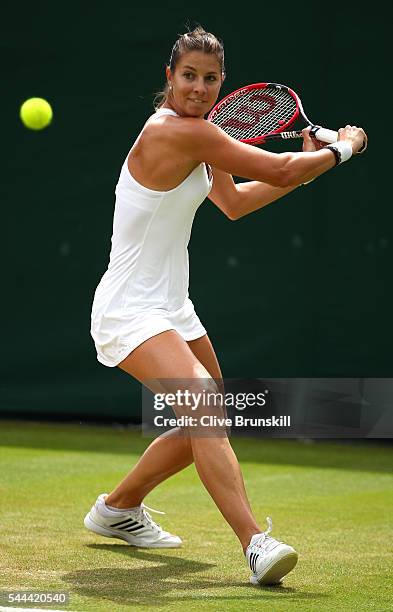 Mandy Minella of Luxembourg plays a backhand during the Ladies Singles second round match against Sloane Stephens of The United States on day six of...