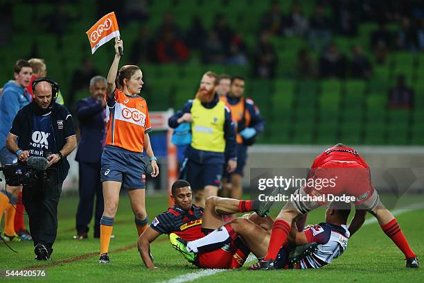 Assistant Referee Amy Perrett, the first ever women referee in Super Rugby history, holds up her flag during the round 15 Super Rugby match between...