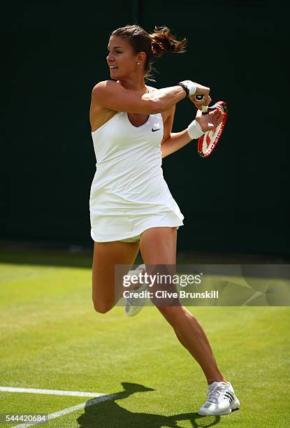 Mandy Minella of Luxembourg plays a forehand during the Ladies Singles second round match against Sloane Stephens of The United States on day six of...