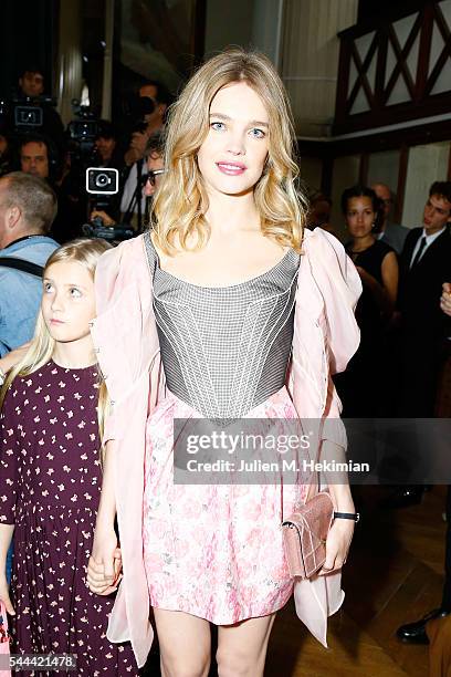 Natalia Vodianova and her daughter attend the Ulyana Sergeenko Haute Couture Fall/Winter 2016-2017 show as part of Paris Fashion Week on July 3, 2016...